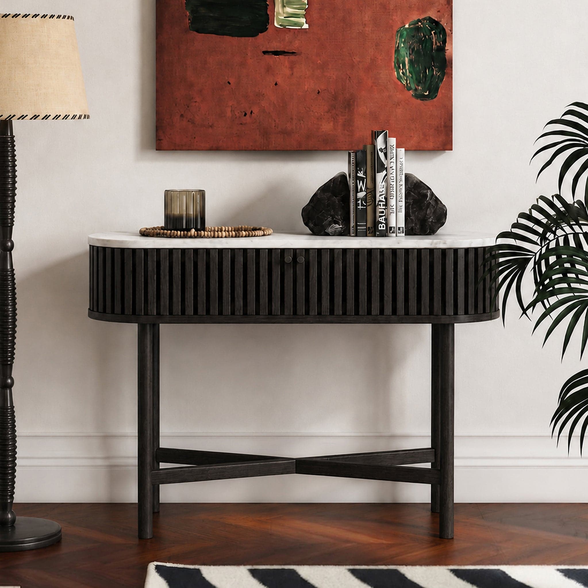 Shorwell Black & Marble Oval Console Table styled in a hallway